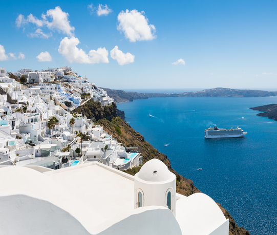 Santorini island, Greece – April, 18, 2023: White architecture in Santorini island, Greece.